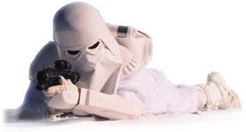 Image of a snowtrooper laying on the ground, ready to give covering fire for his fellow troopers